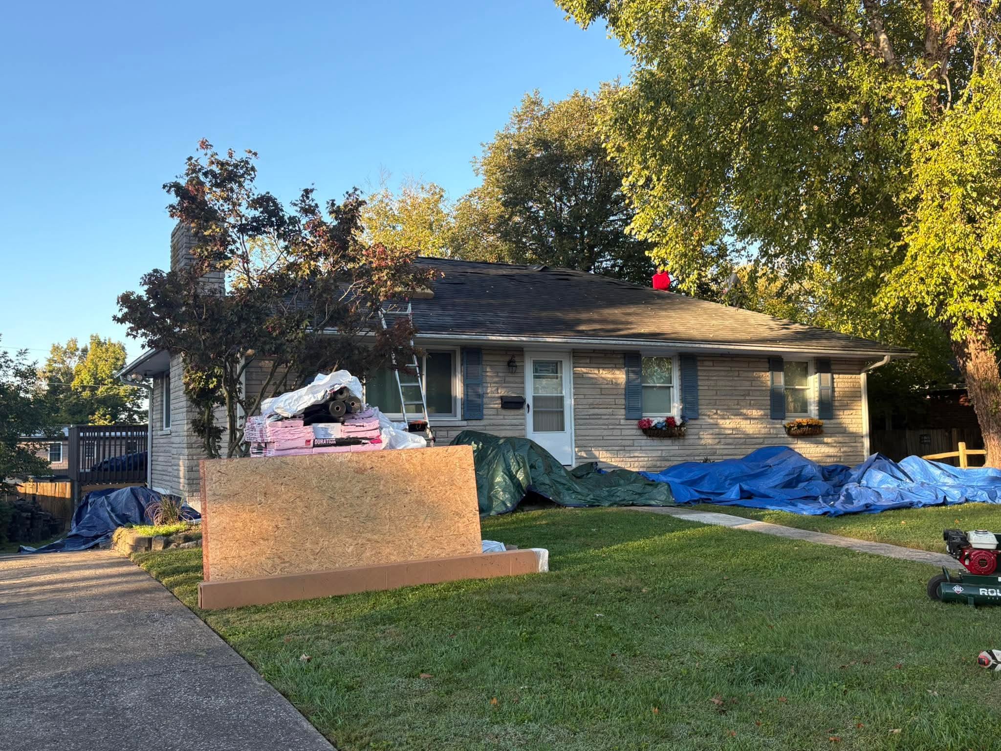 Arcline Roofing crew working on a roof replacement project